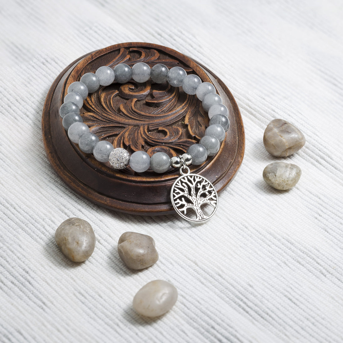 gray agate bracelet next to gray agate beads