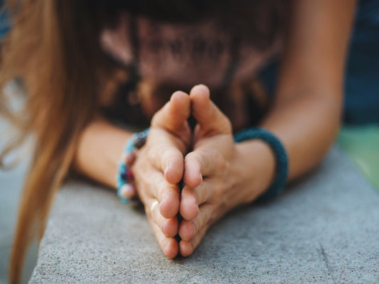 Woman hands together symbolizing gratitude.